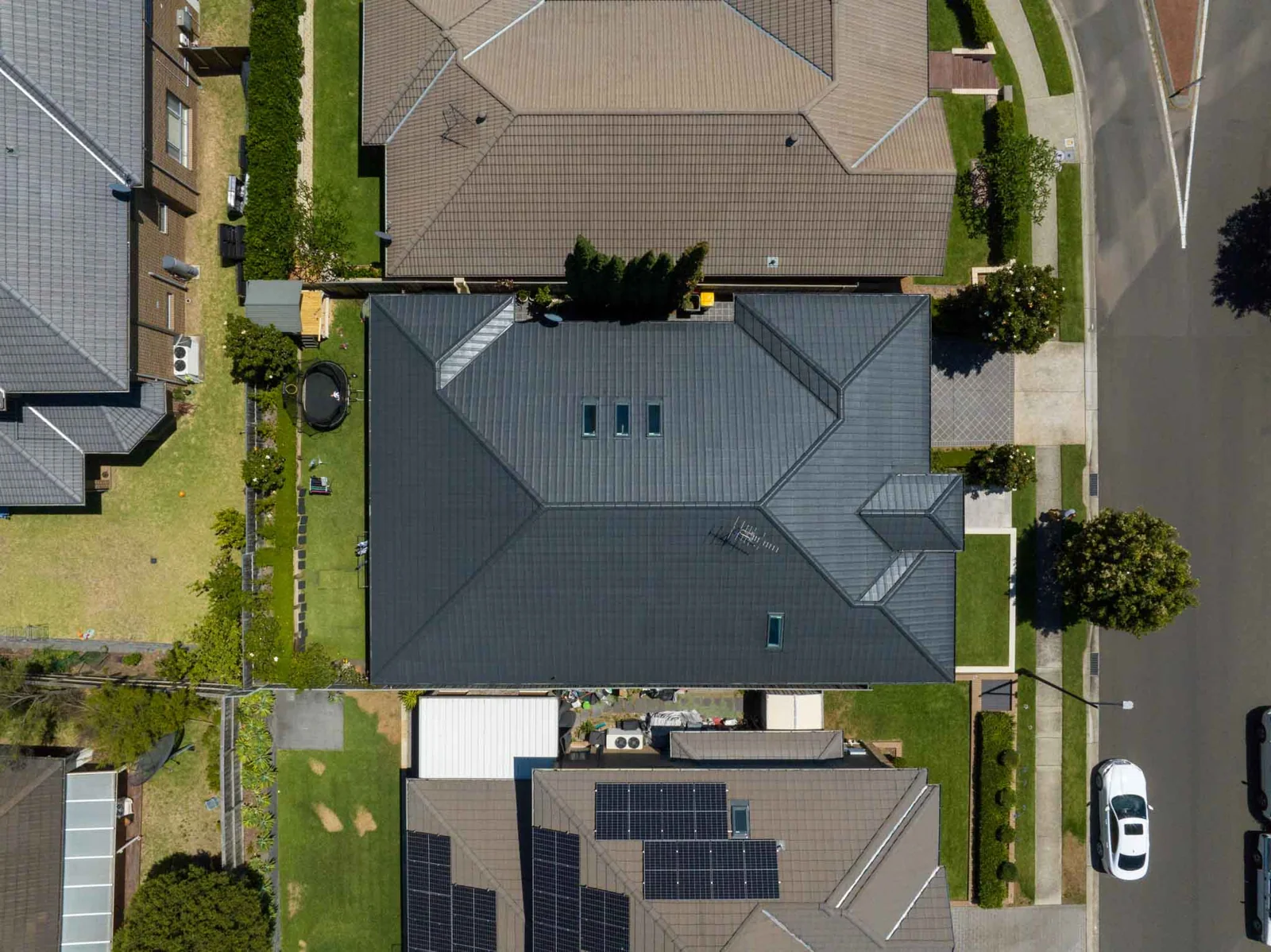 Aerial view of a residential roof and its drainage layout